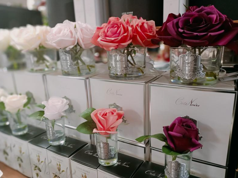 
                  
                    A display of roses and flowers in clear glass vases with pretty gift boxes, as seen at Natashas skin Spa beauty salon on City Road in Southbank Melbourne, Australia, for sale for flower delivery or purchasing in the spa retail florist
                  
                