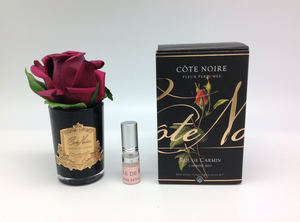 
                  
                    Cote Noire Single Rosebud in Carmine Red, in a black glass vase, presented in a black gift box with a spritzer of rose petal perfume
                  
                